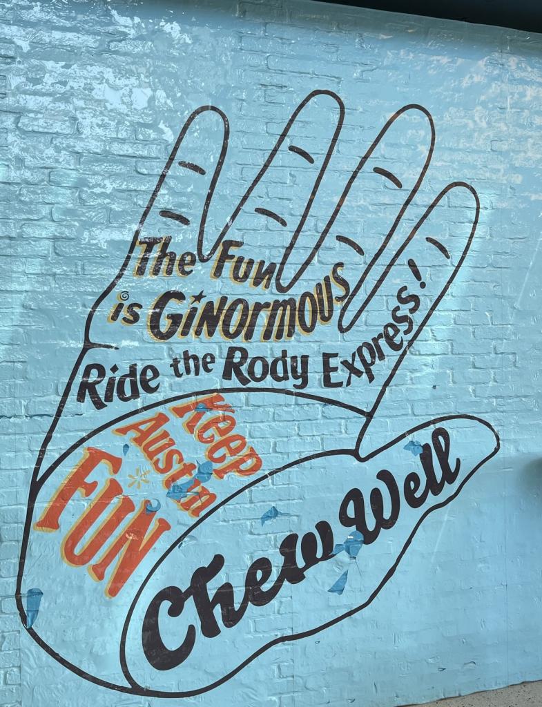 Photo of a large graffiti hand located on the wall of Toy Joy at AUS.