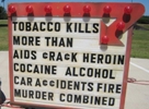 Sign that says tobacco kills more than many other causes combined.
