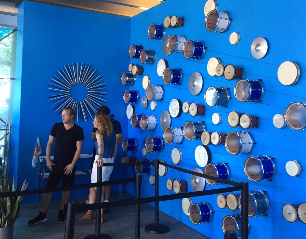 Drums and drumsticks decorate a wall in the 'American Express Experience' VIP tent at ACL.