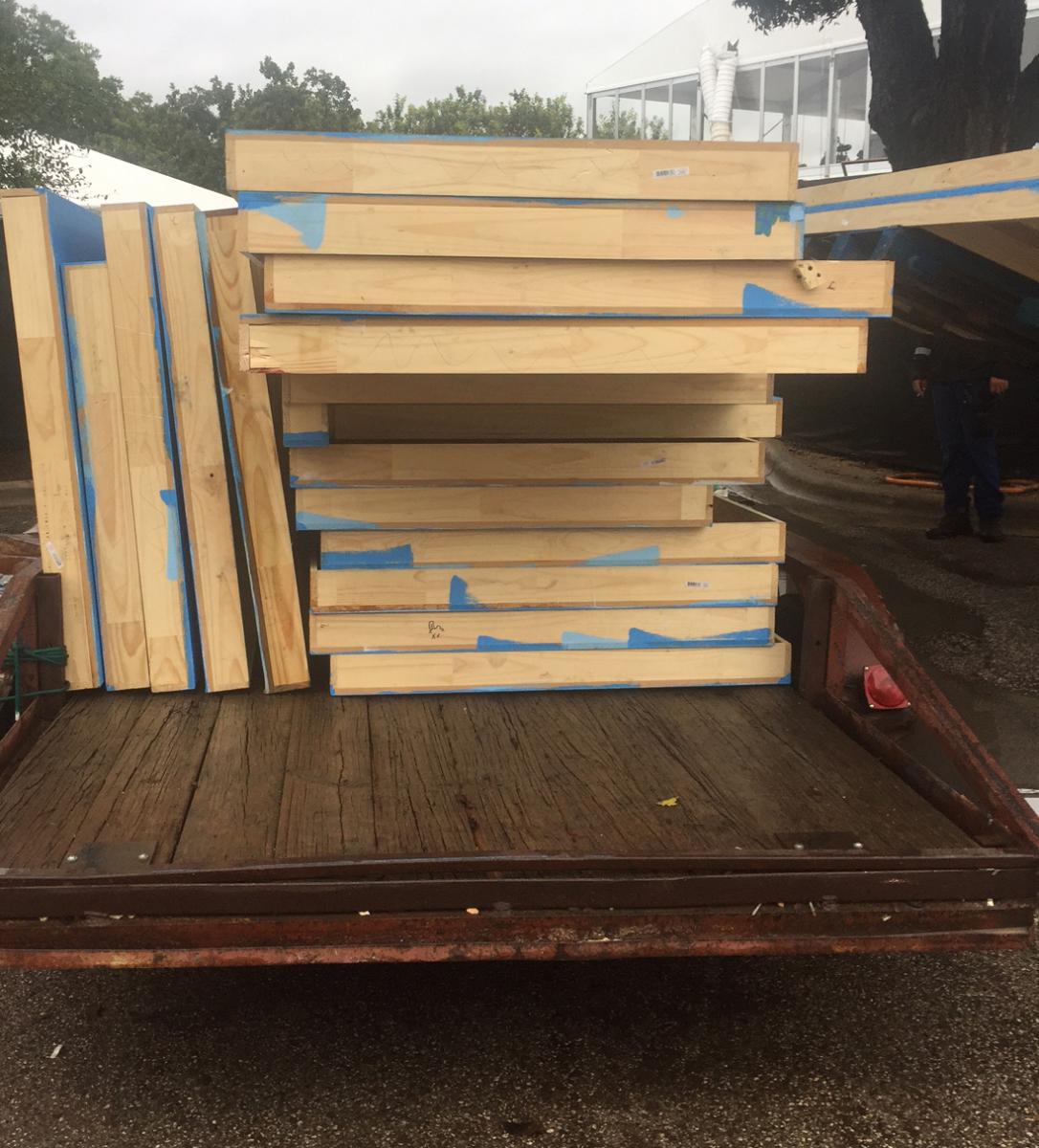 plywood from ACL stage structures being loaded up and sent to community partners for reuse.