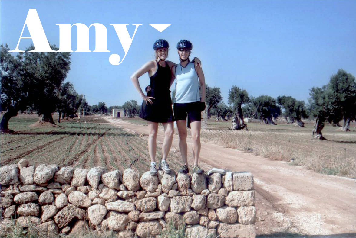 Text: Amy over picture of Amy and her sister in Italy wearing bike helmets