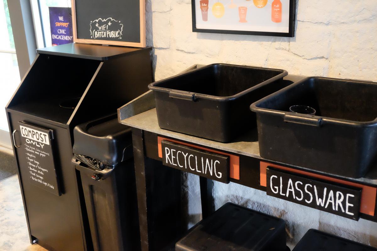 Compost, recycling, and glass bins.