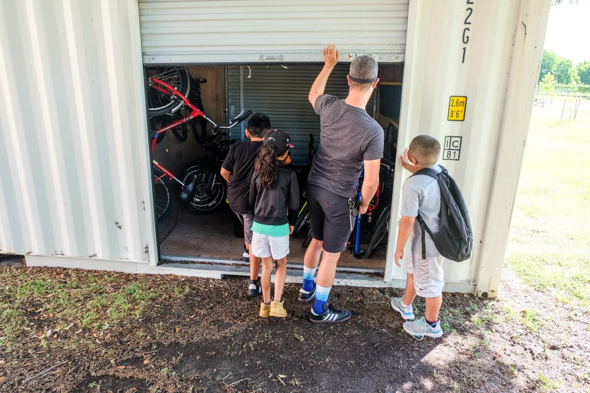 Getting bicycles out of the bicycle shed.