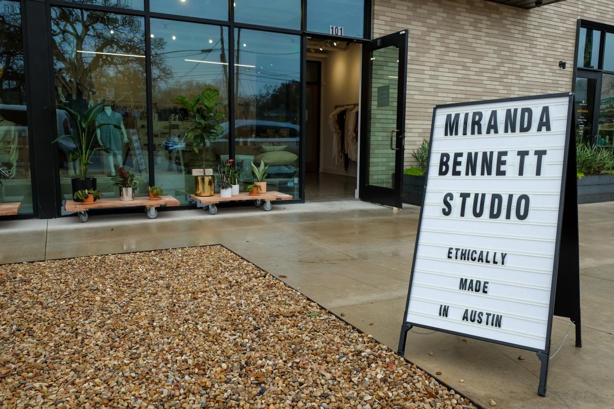 Exterior of Miranda Bennett Studio. Sign reads "Miranda Bennett Studio - Ethically made in Austin, Texas"