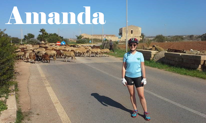 Text: Amanda, picture of Amanda with sheep in background