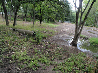 The stormdrain pipe originally stretched 100 ft across the Shoal Creek Greenbelt before discharging into Shoal Creek.  The pipe became exposed by erosion over time and was starting to break apart.
