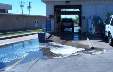 Soapy discharge from a poorly designed car wash facility.
