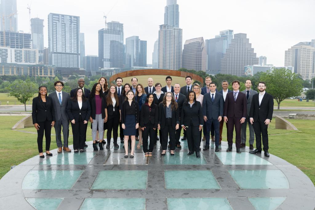 Picture of Office of the City Auditor staff posing in front of the Austin skyline.