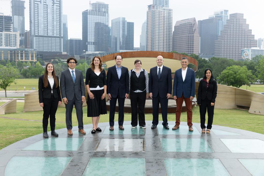 Picture of Office of the City Auditor management team members posing in front of the Austin skyline.