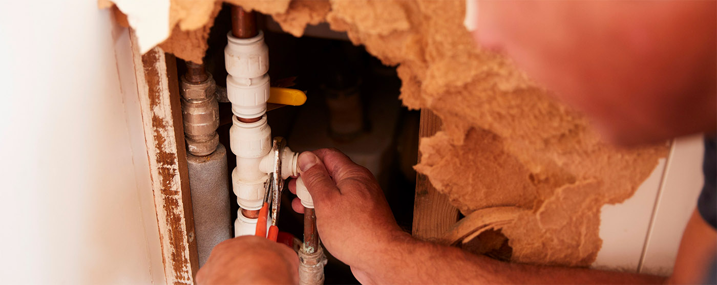 Man fixing pipe