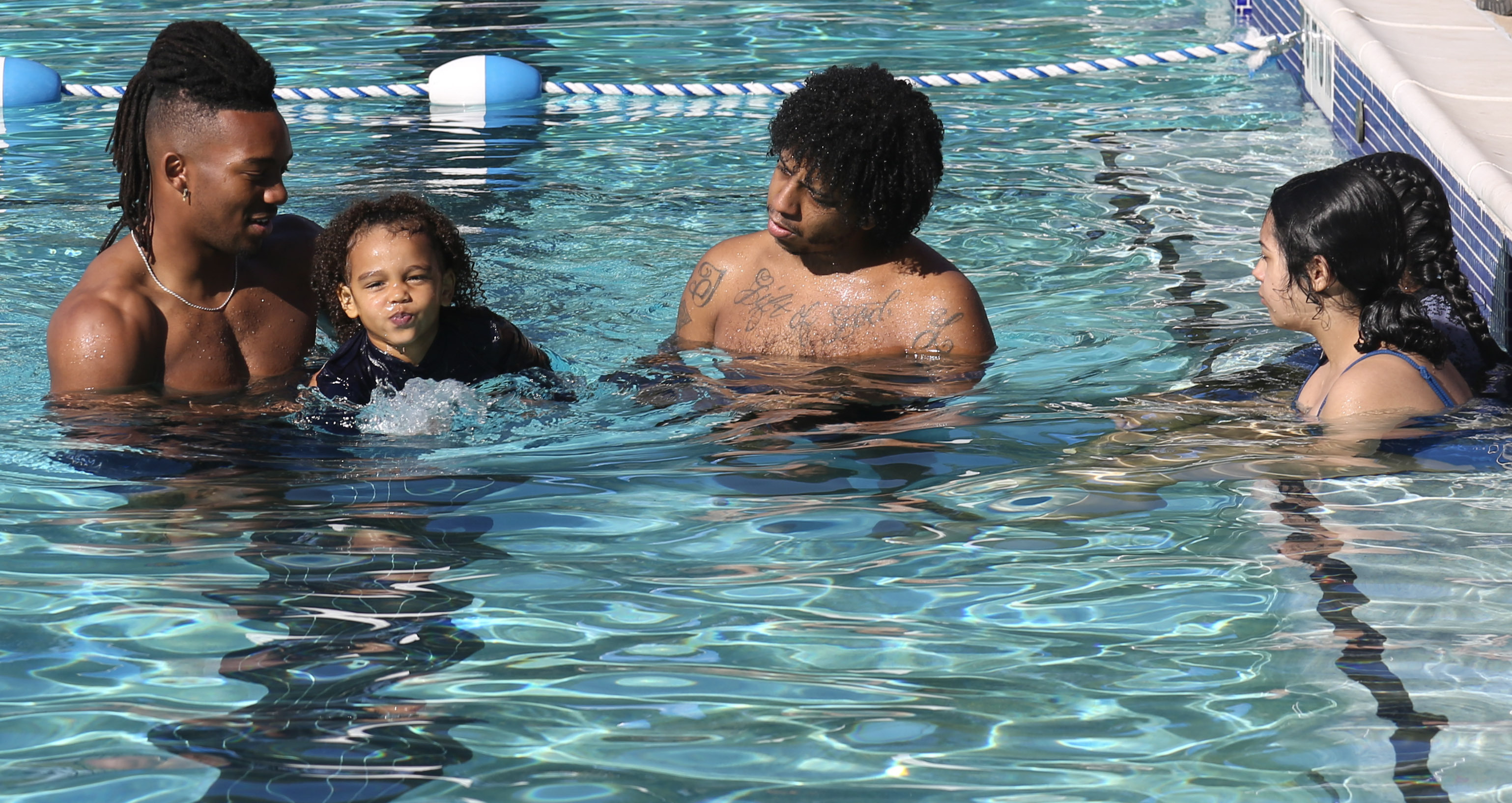 Bijan Robinson Teaches Kids to Swim to Raise Awareness About Water Safety with Nonprofit Tankproof and Austin Parks and Recreation