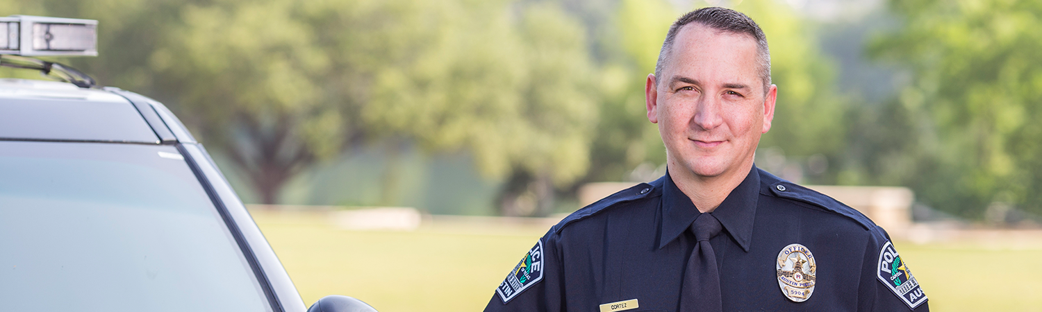 Officer next to patrol vehicle