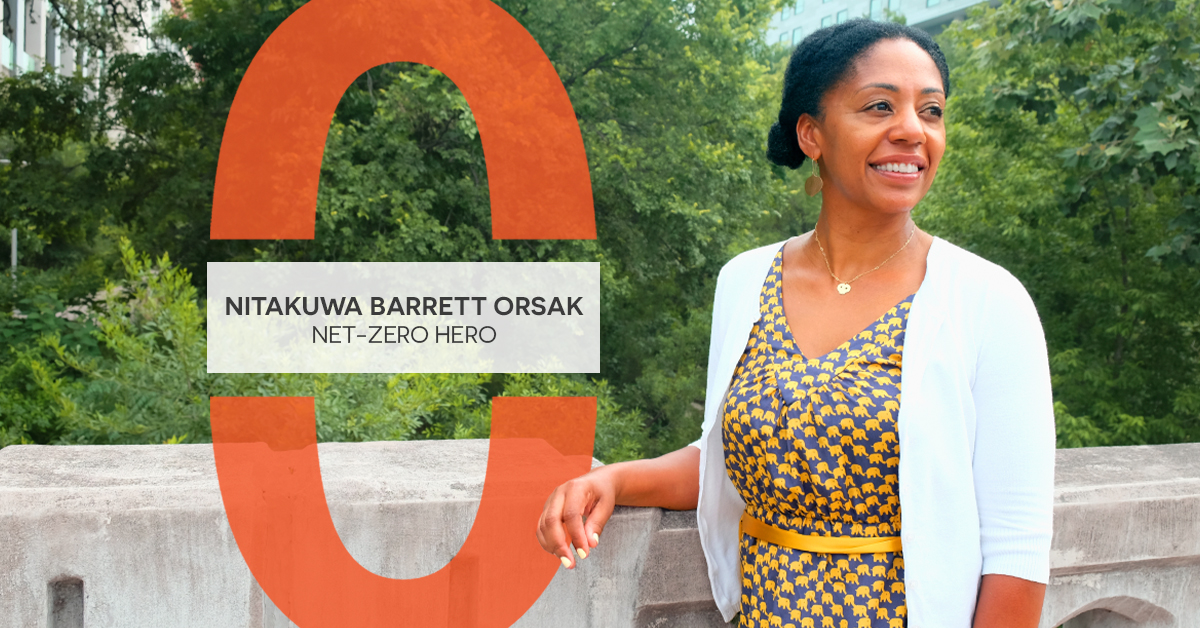 Nitakuwa looks off in the distance smiling on a bridge over Waller Creek Greenbelt.