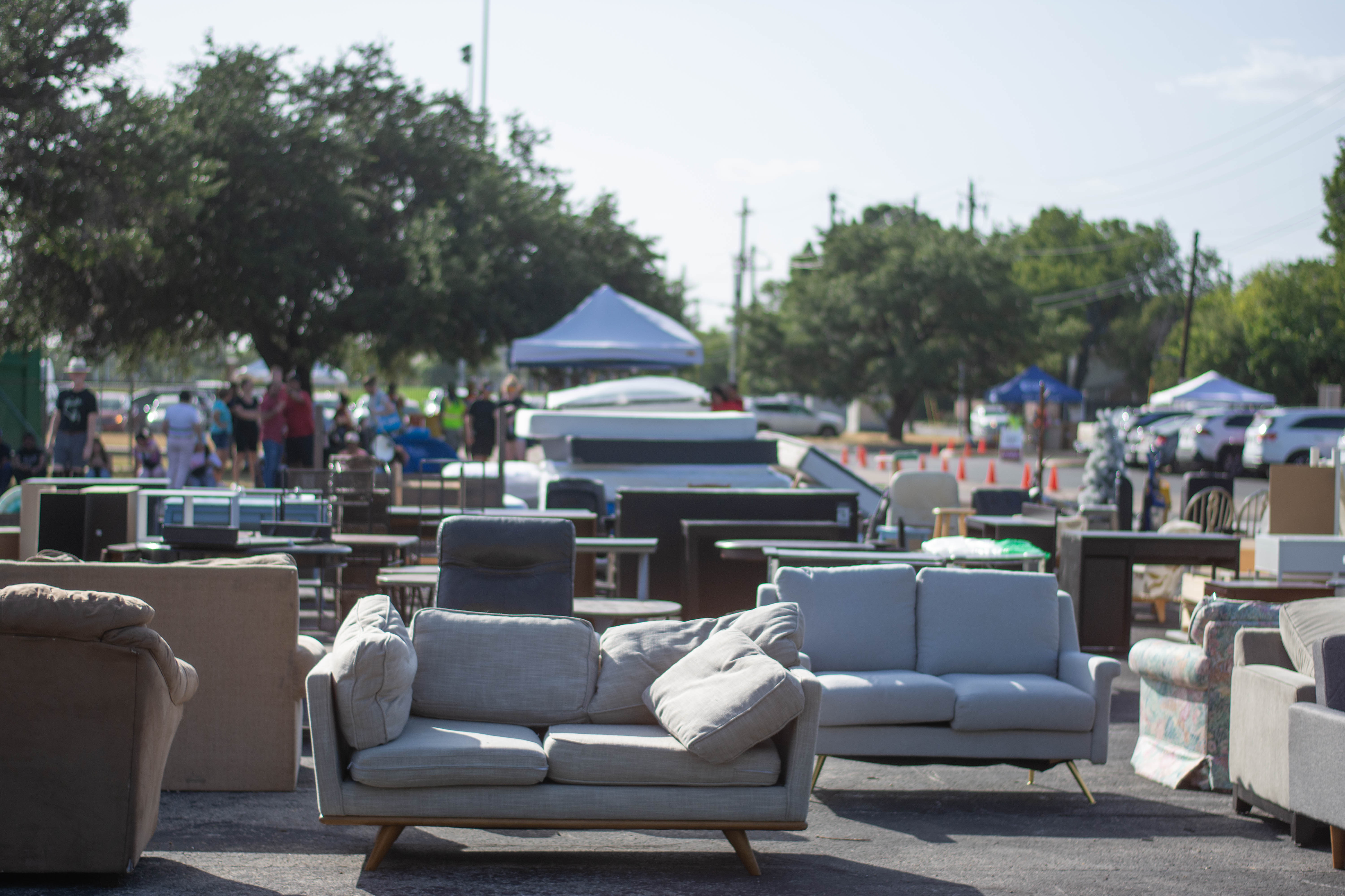 Furniture is set out in a parking lot at MoveOutATX’s Free Furniture Market that was held in July 2023.