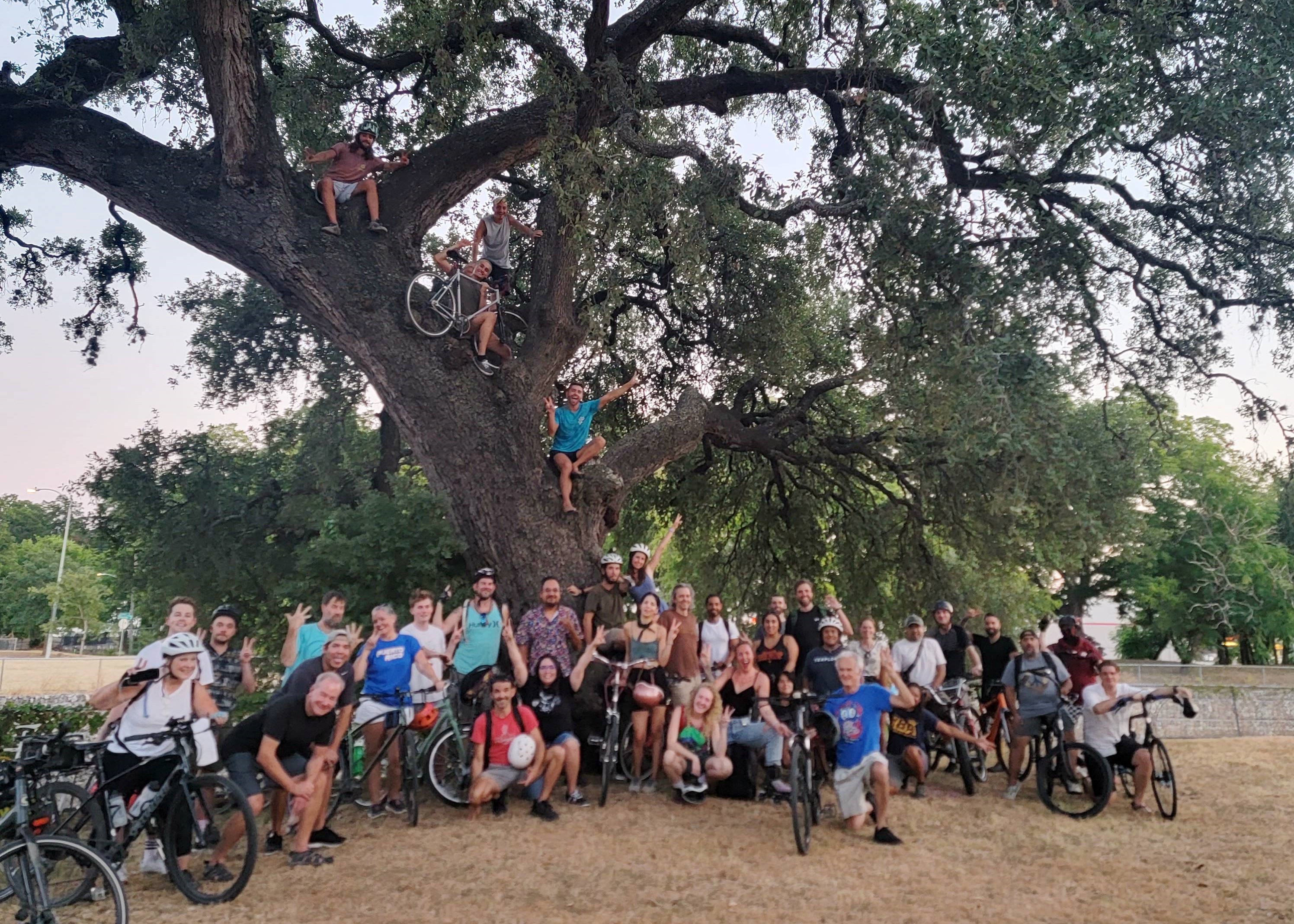 A Ride Bikes Austin meet-up with bikes in front of a tree in Parque Zaragoza