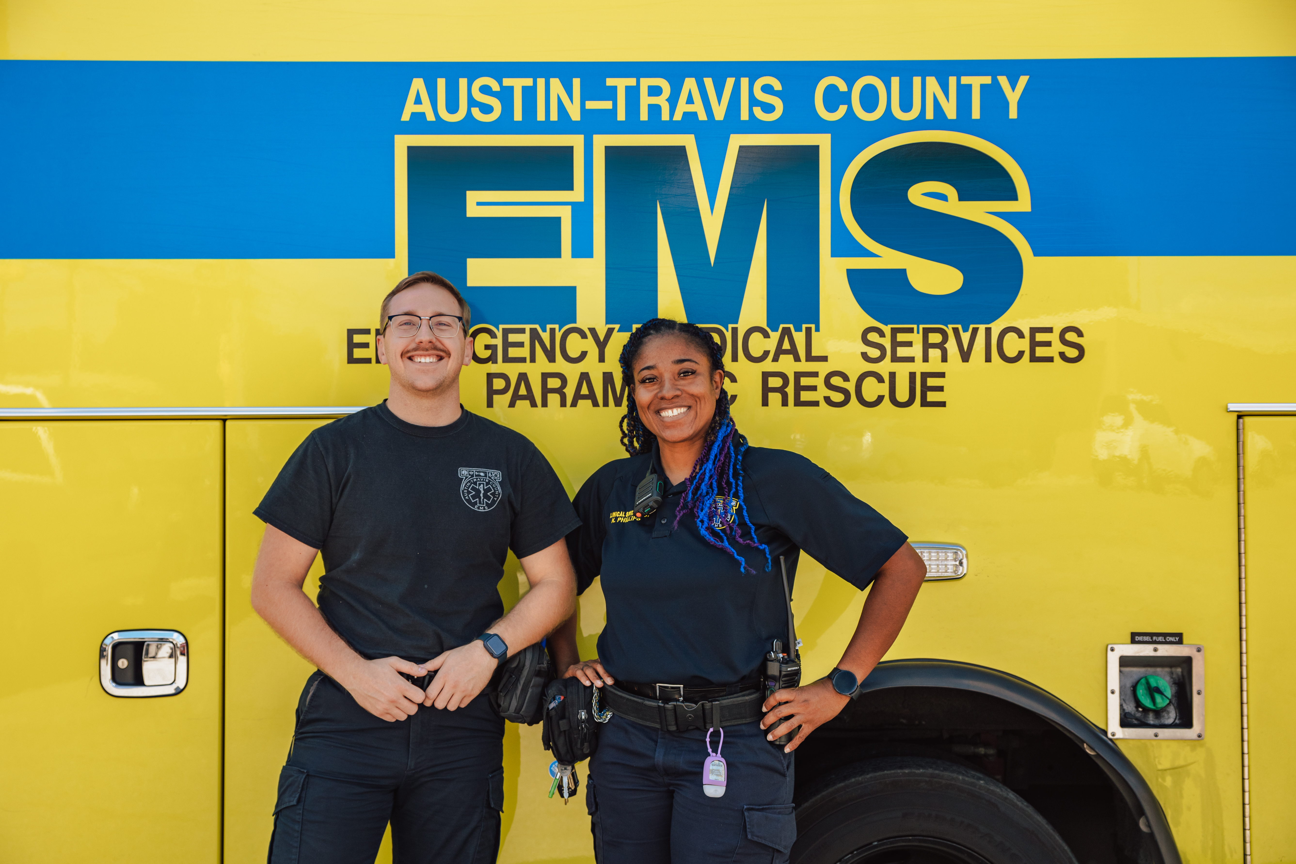 Medics in front of ambulance.