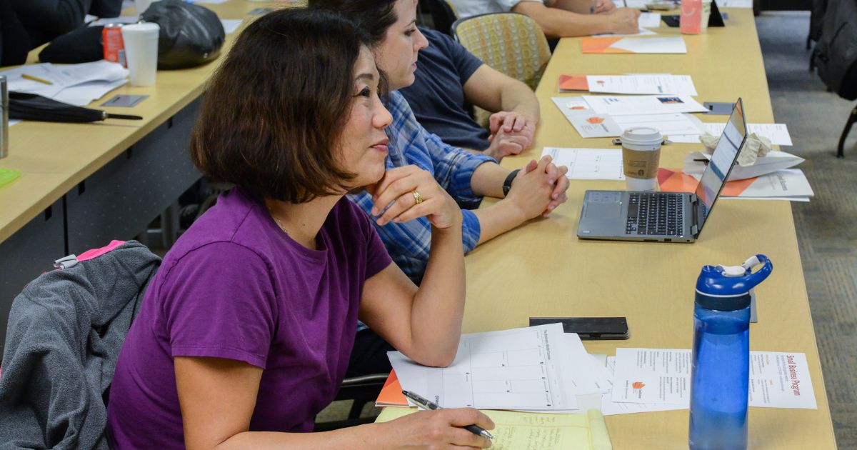 People listening in a small business class