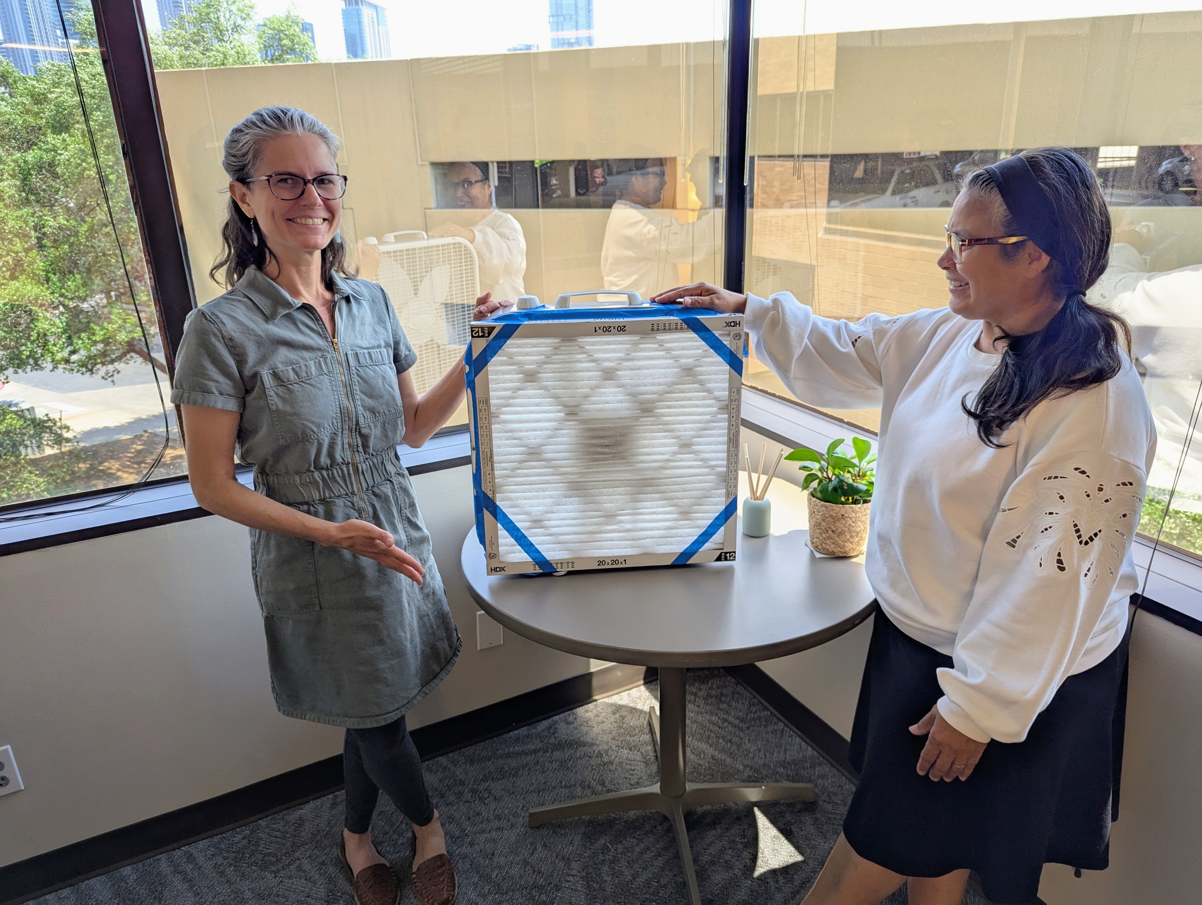 Office of Climate Action and Resilience team members pose with DIY air filter