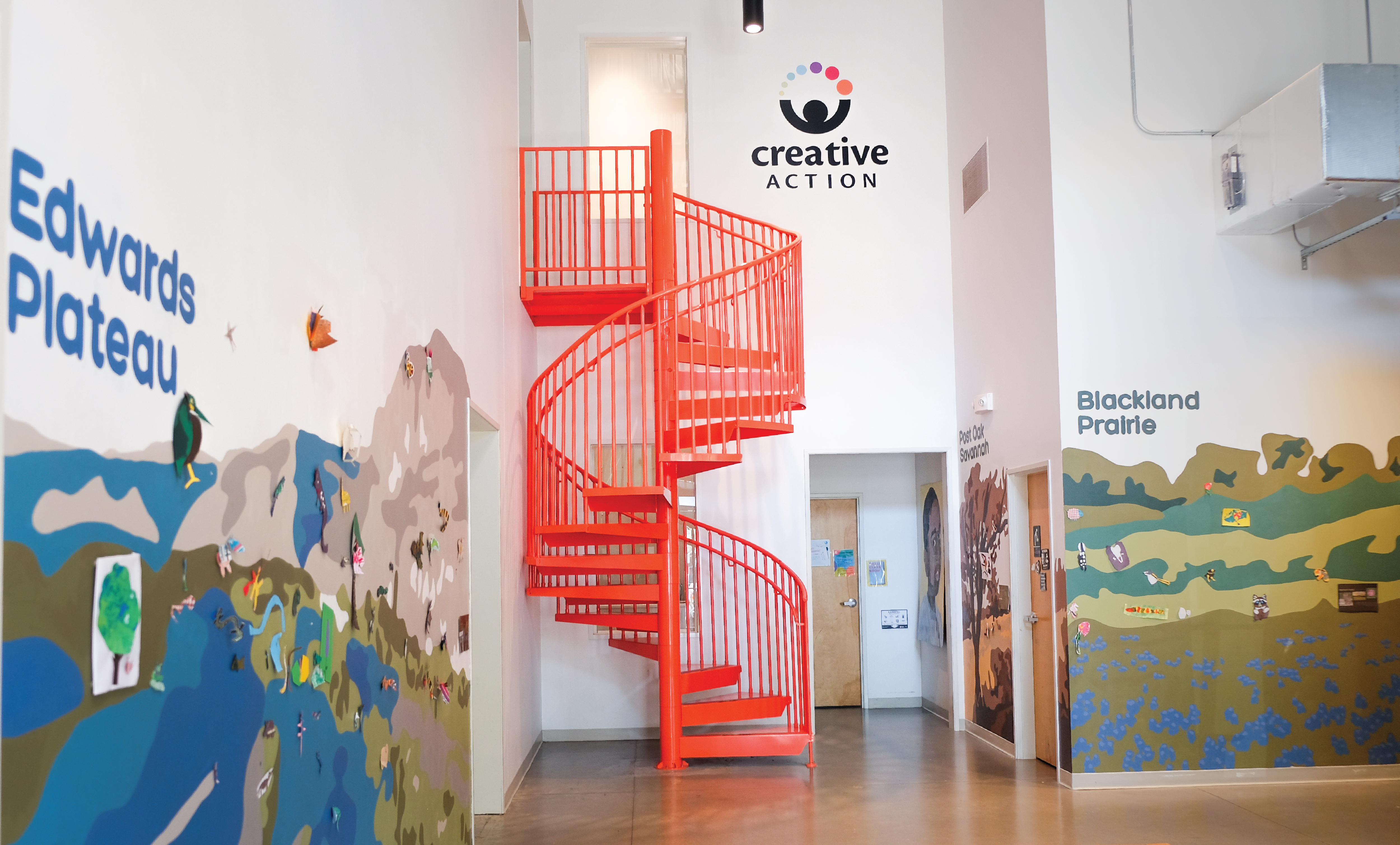 Sustainability art education mural in the foyer of the Creative Action building
