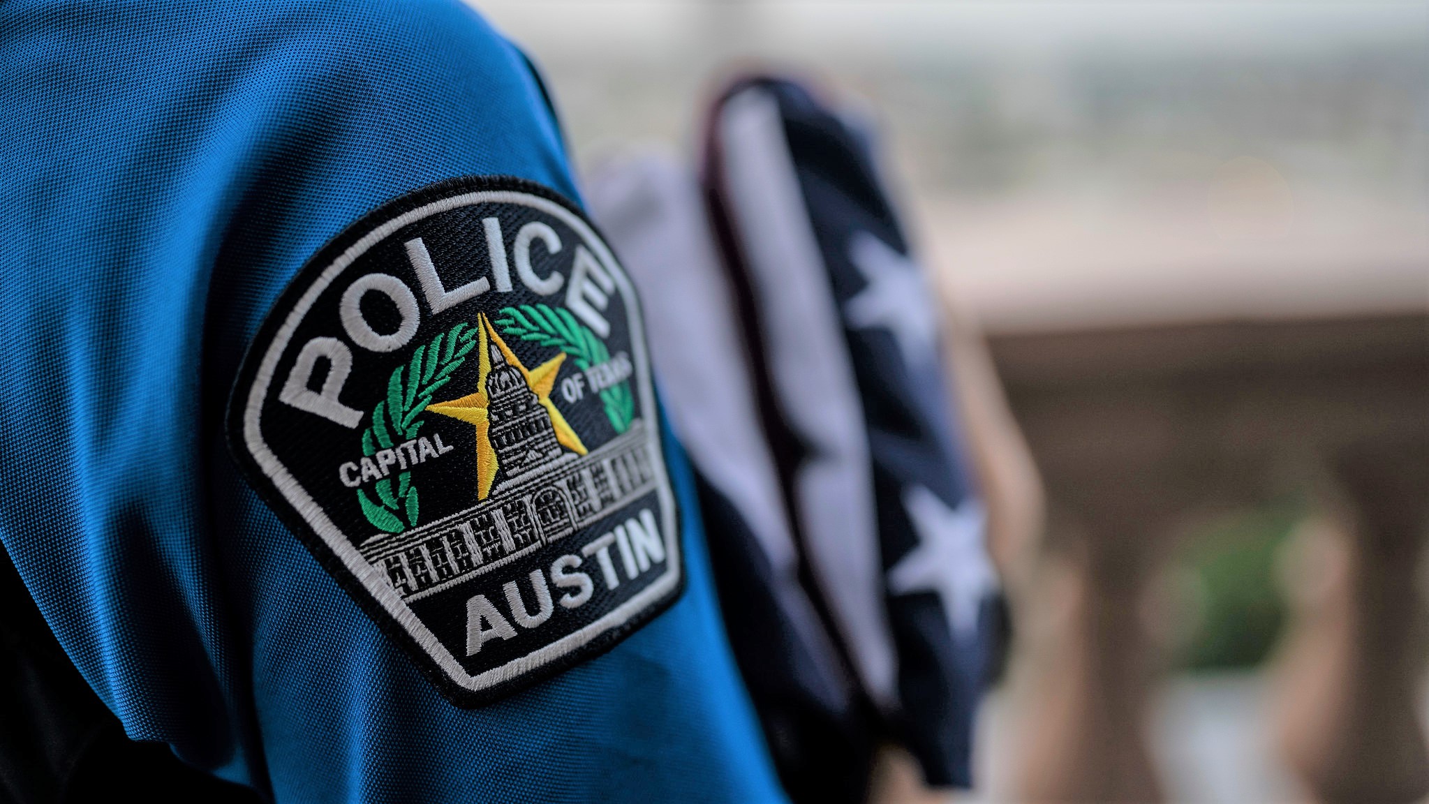 Austin Police Department patch on the arm of a shirt.