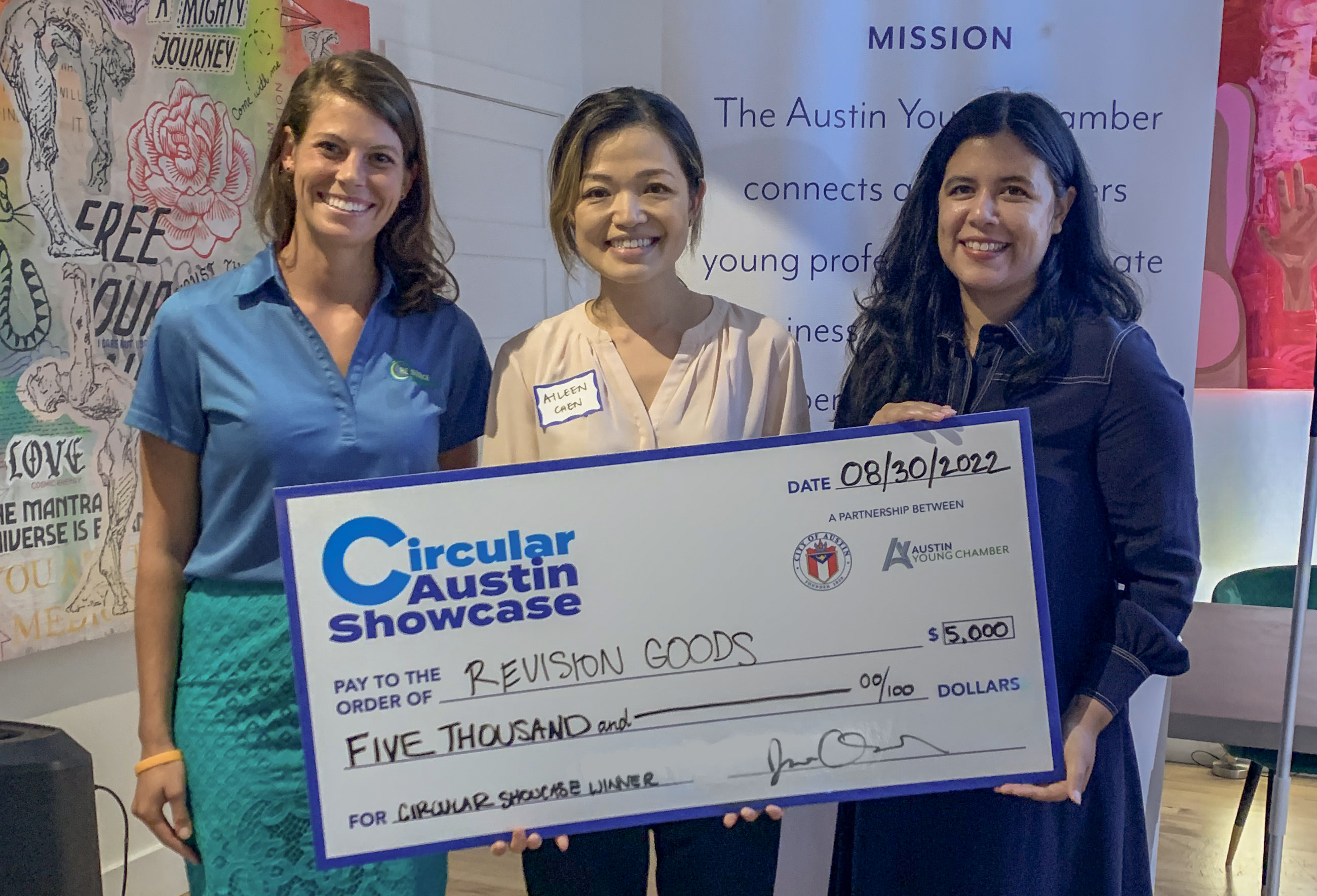 REVISION GOODS announced as winner of $5,000 cash prize Aileen Chen (center) accepts the cash prize at the Circular Austin Showcase from Madelyn Morgan (left) and Joana Ortiz (right).