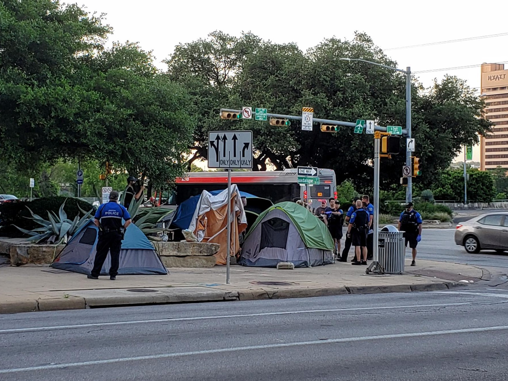 Photo of police talking to community members on Cesar Chavez