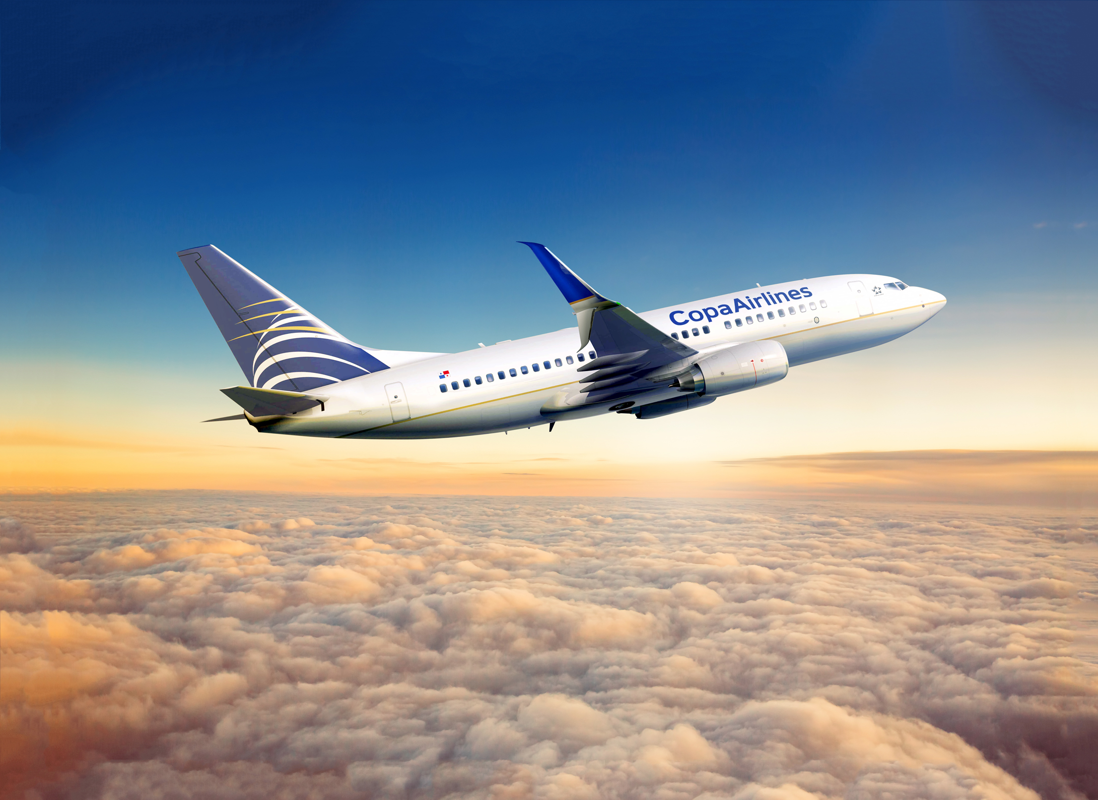A Copa Airlines aircraft is midflight above the clouds.