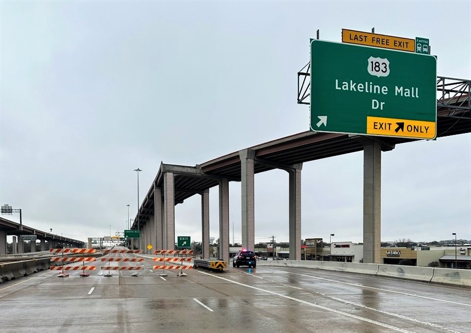 barricades on a highway establishing a road closure barricades on a highway establishing a road closure