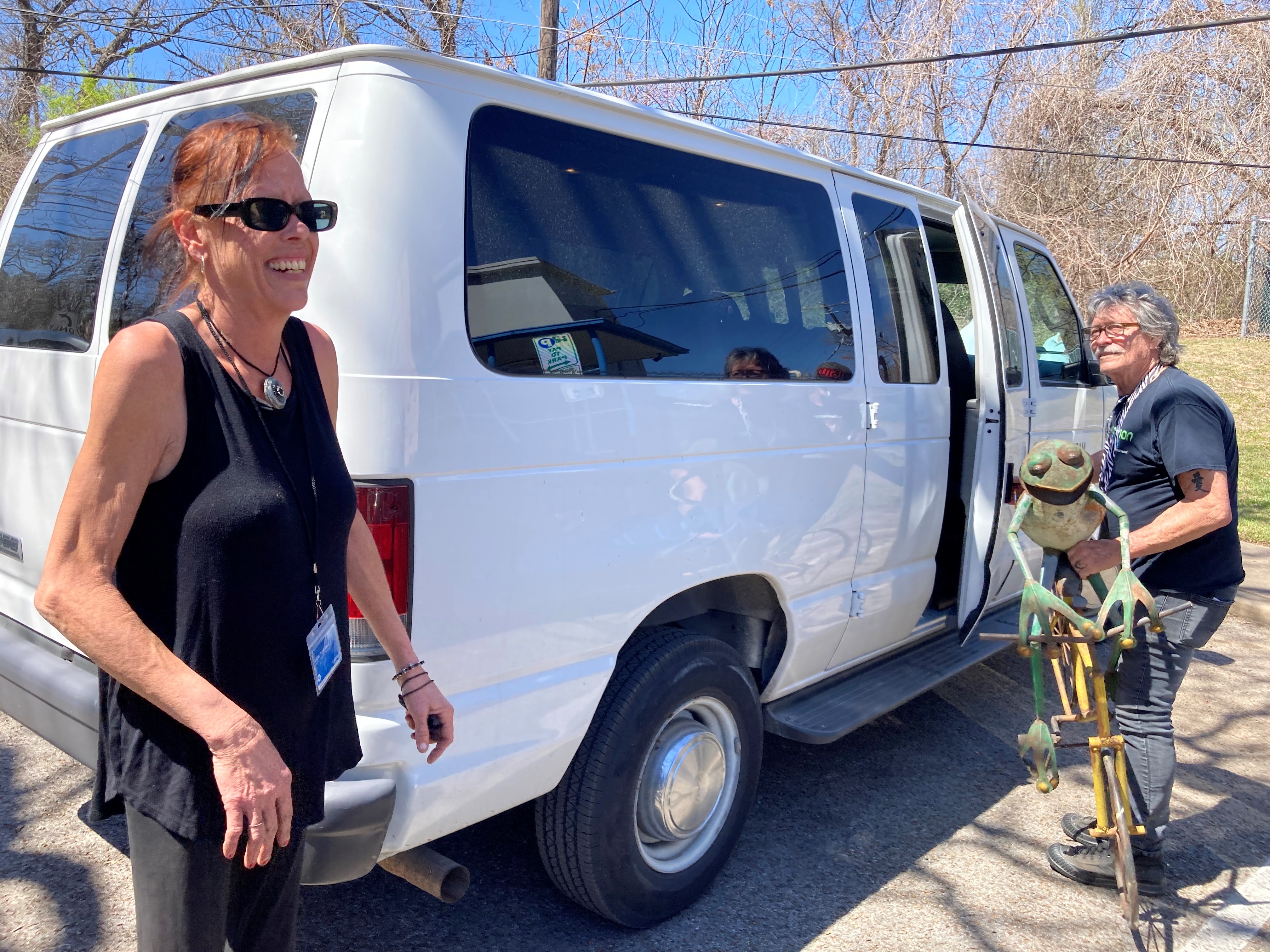 HOST outreach team helps an encampment resident move her belongings.