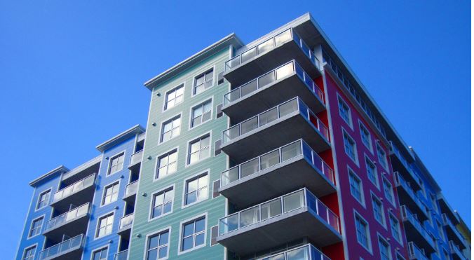 Image of a blue apartment building