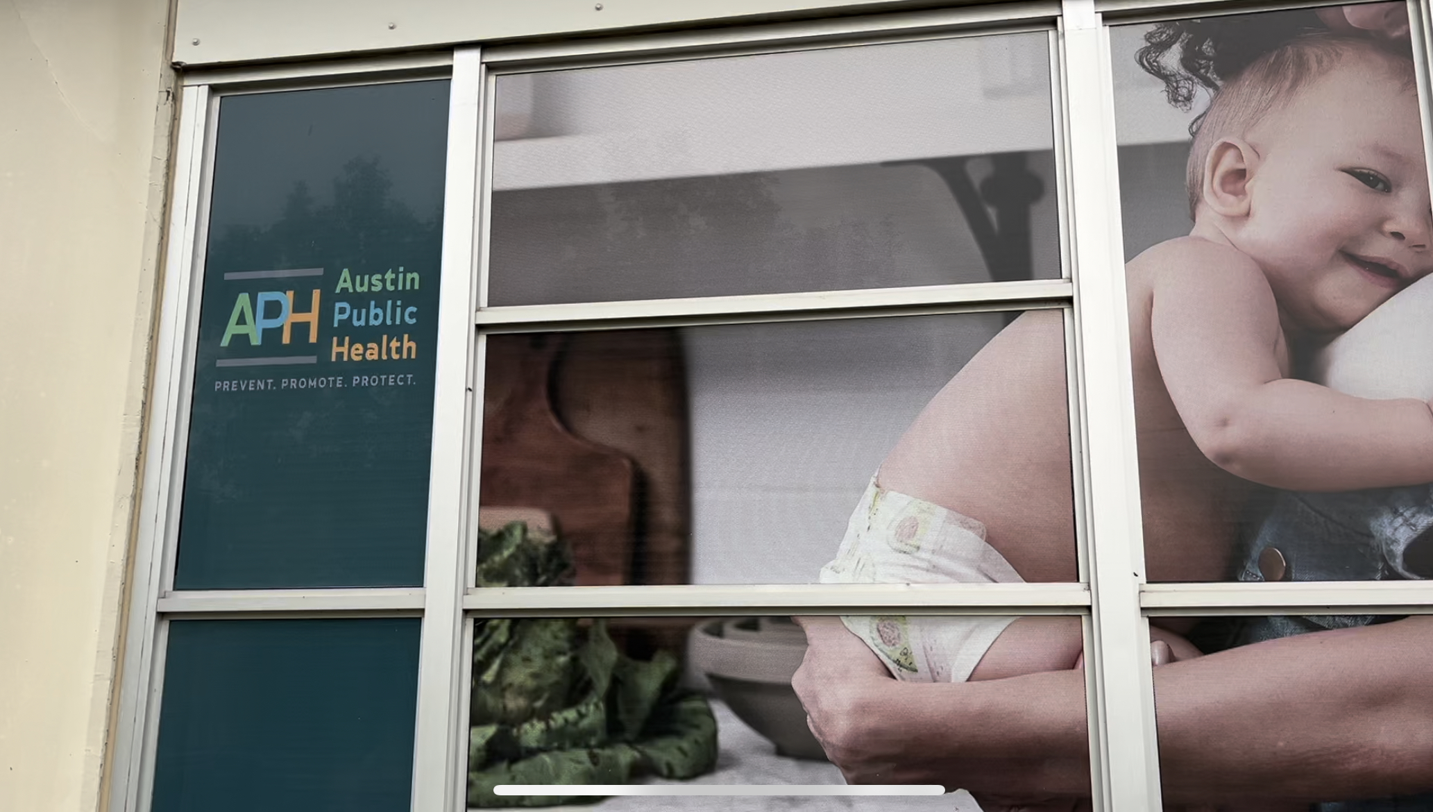Austin Public Health Building with image featuring a baby.