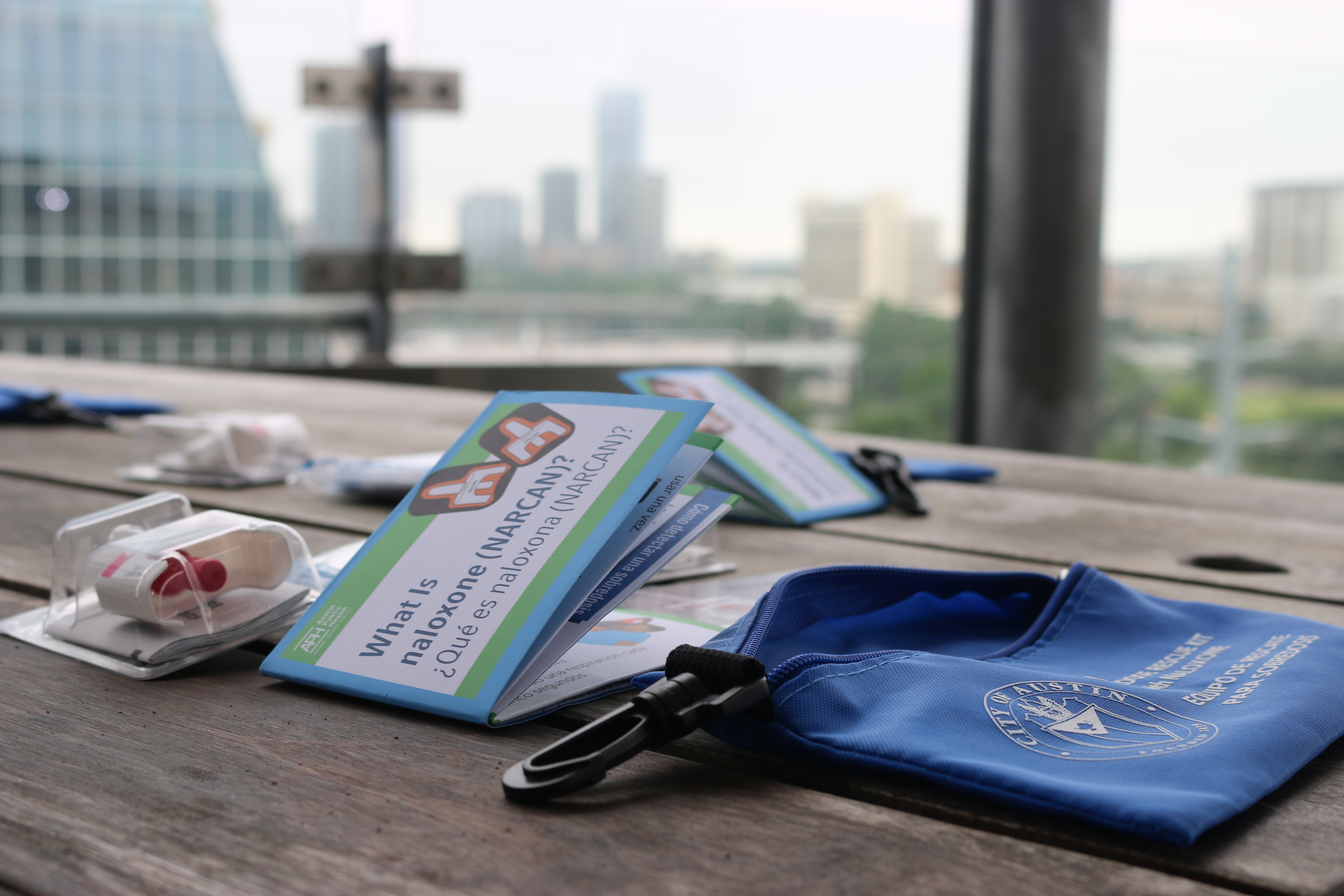 A photo of City of Austin naloxone kits lying on a table.