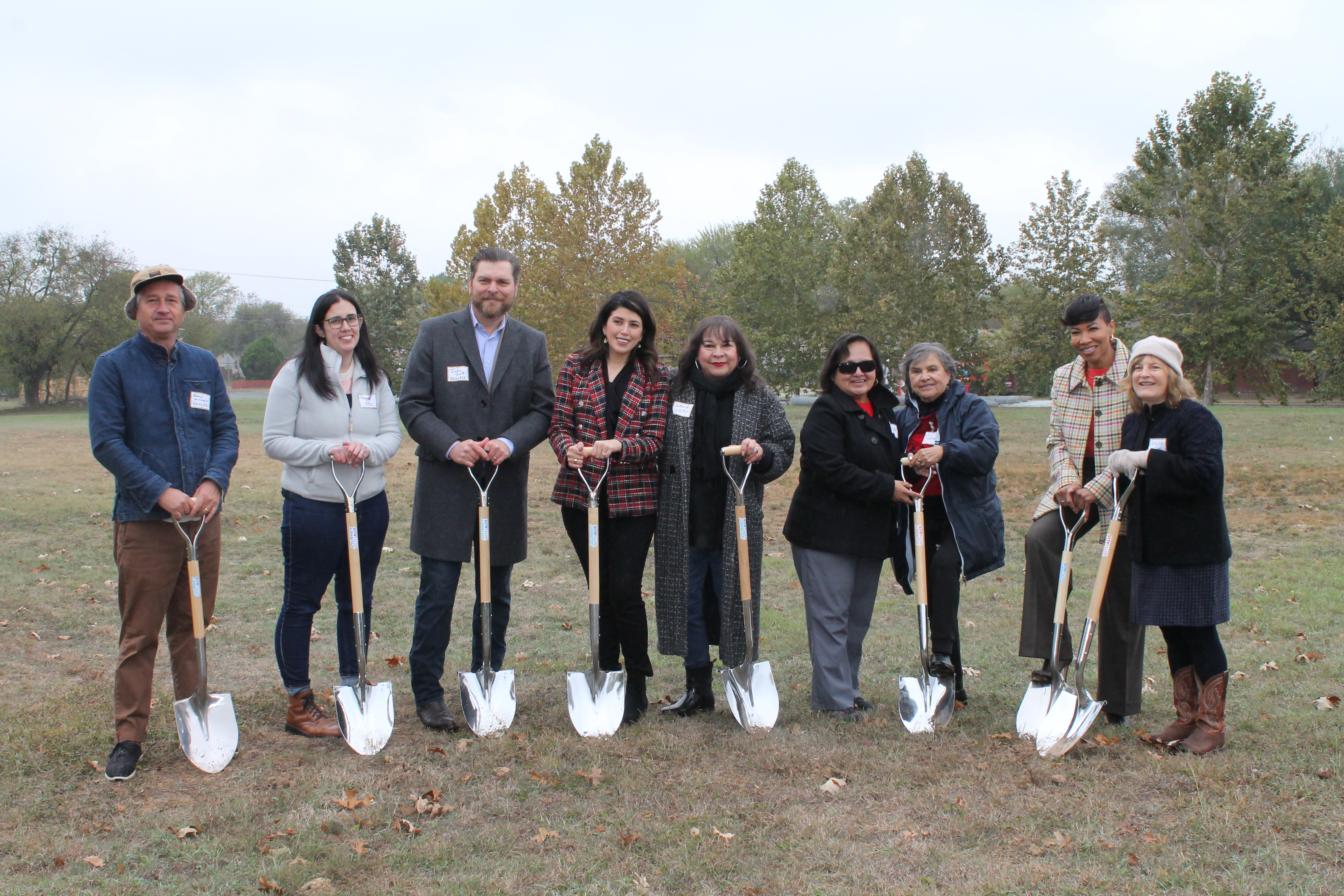 Image shows city officials and developer and community partners holding shovels.