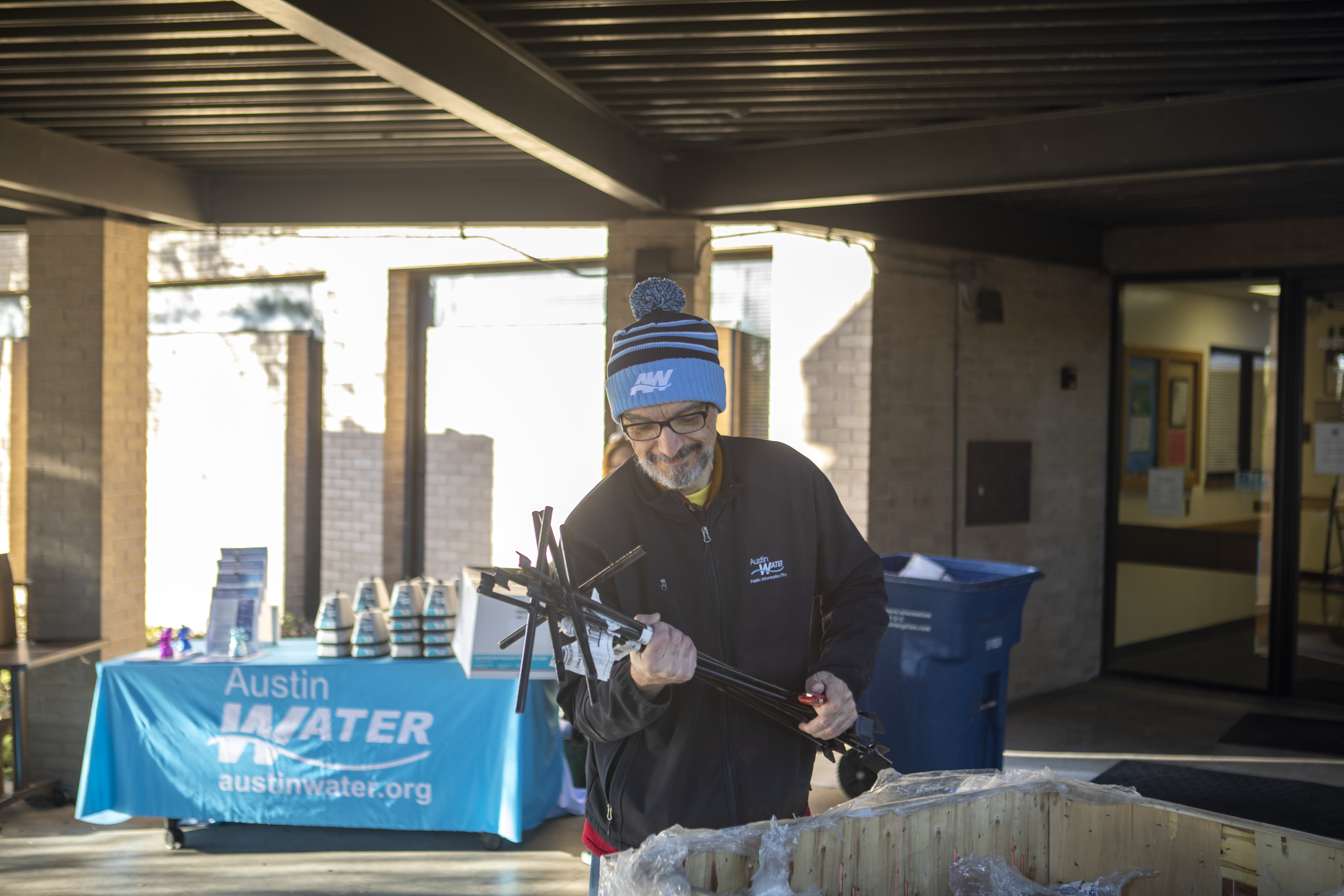 An Austin Water Utility employee sorting water meter keys before distributing them to customers.