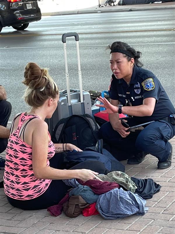 Officer conducting homeless outreach