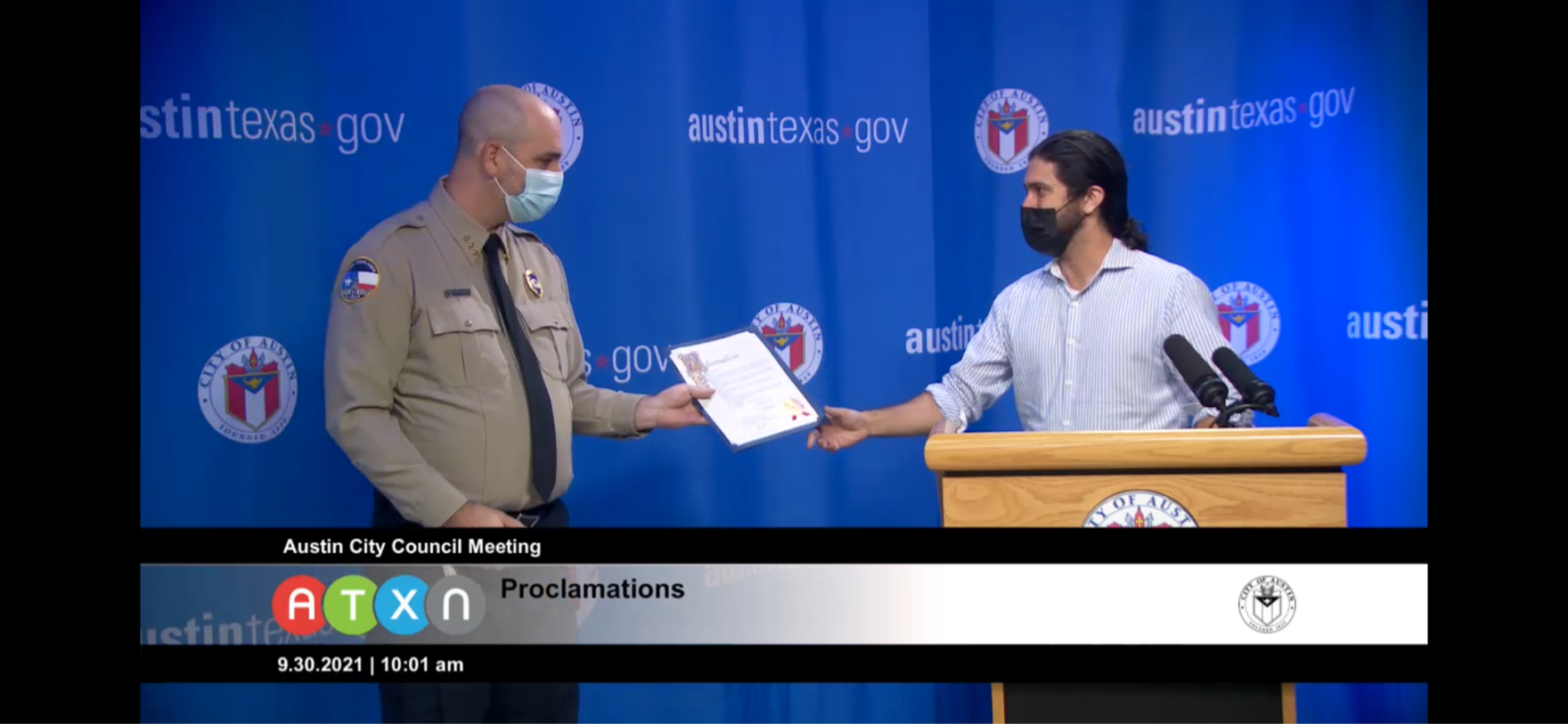 Screenshot from ATXN showing Assistant Director Daniel Word accepting the City's Proclamation of National Code Compliance Month beginning October 1.