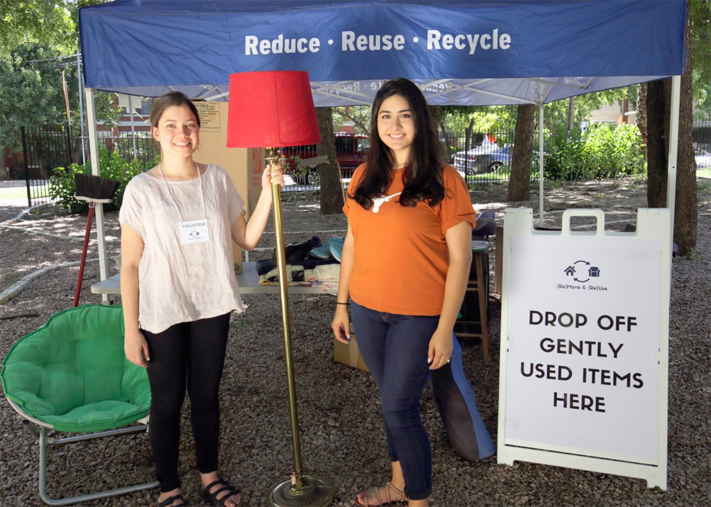 Students search for items at free MoveOutATX furniture market