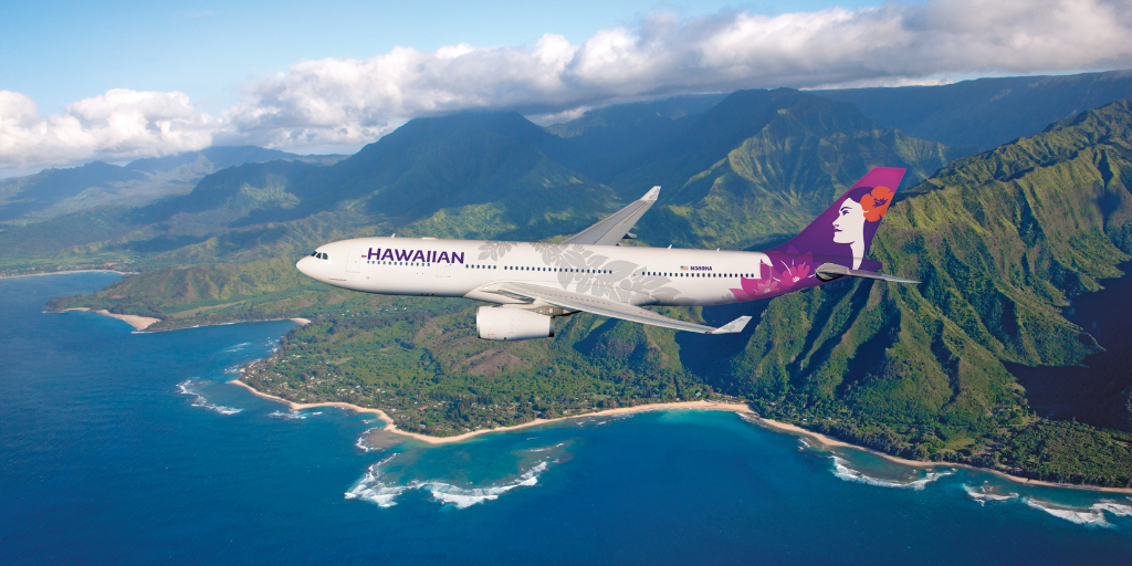 photo of a Hawaiian Airlines Airbus A330 flying over the Hawaiian coastline