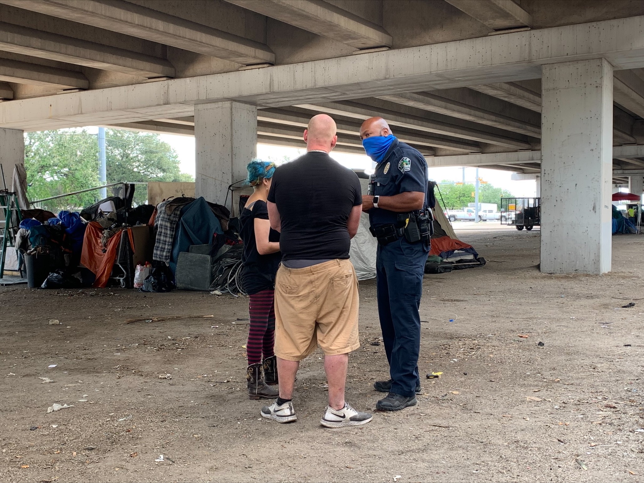 Image of Austin Police Officers visiting an encampment