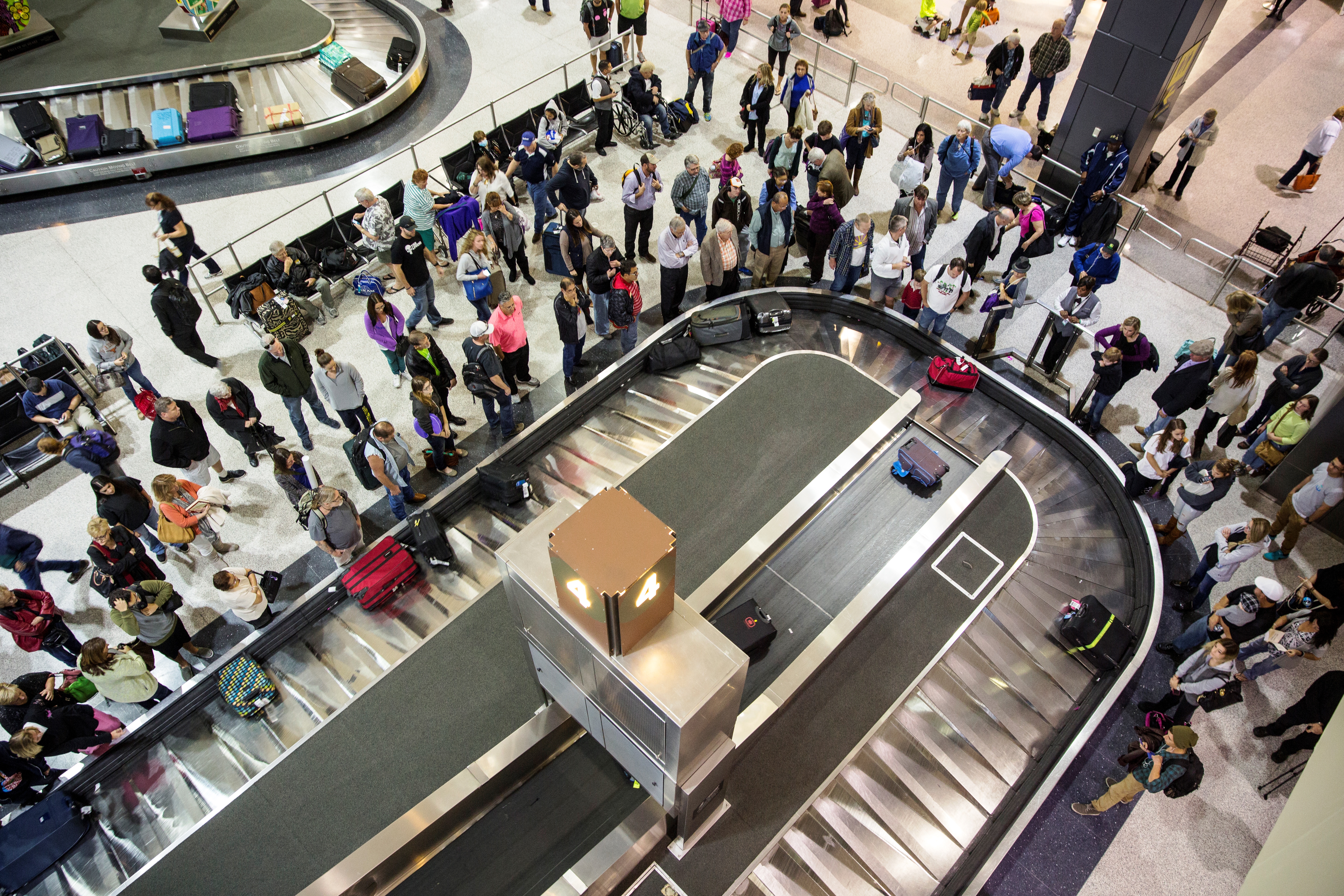 Increased passengers around baggage carousel