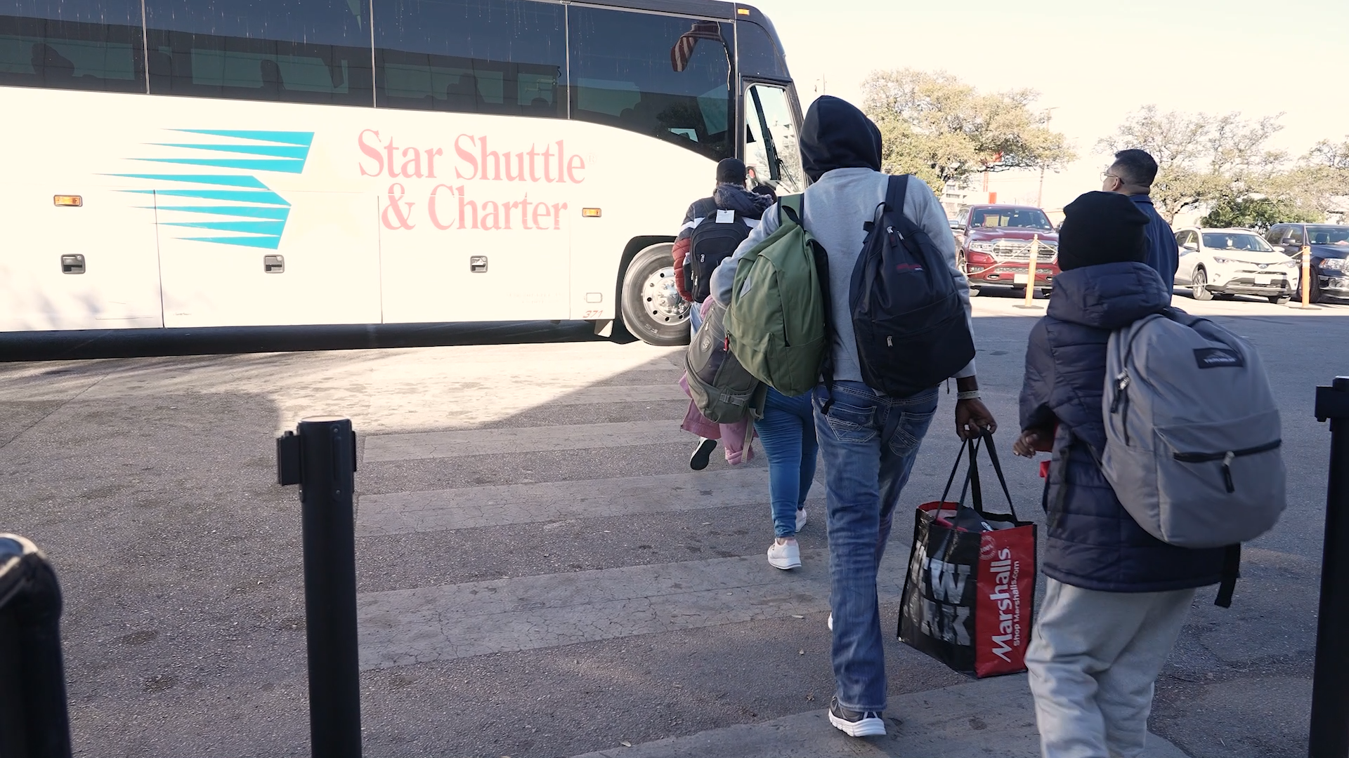 Guests getting on a bus in San Antonio to come to Austin airport. 