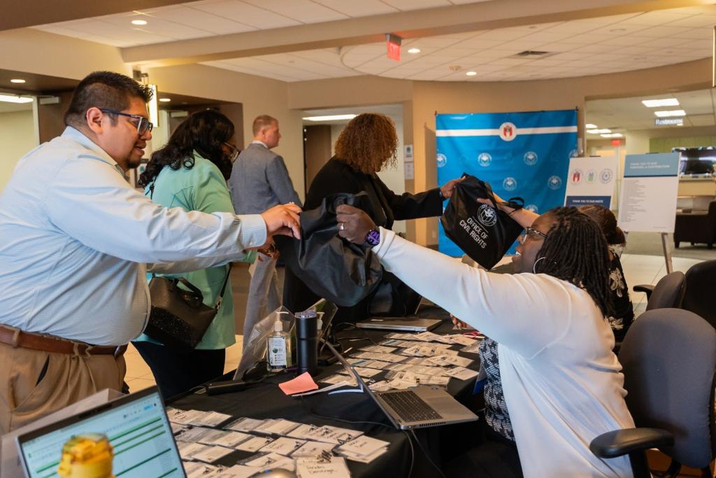 Attendees check in at the welcome table for last year’s 2024 Fair Housing Conference & Resource Hub.