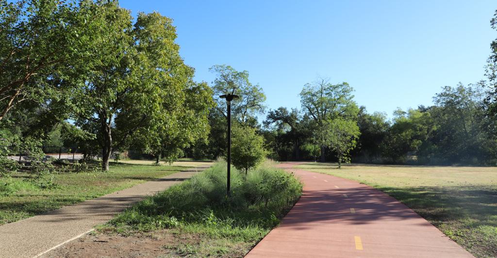 Two-way bicycle path adjacent to vegetative median and sidewalk.