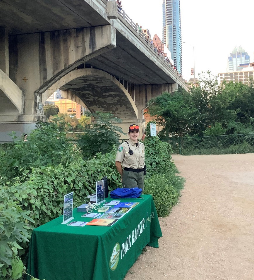 A trail ranger shares information on Ann and Roy Butler Trail.