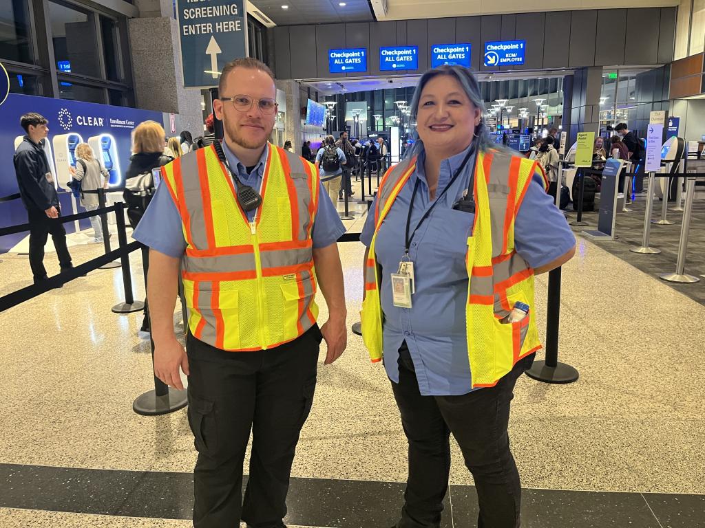 Two Guest Services team members smile for the camera during a short respite in the April 2024 eclipse travel day