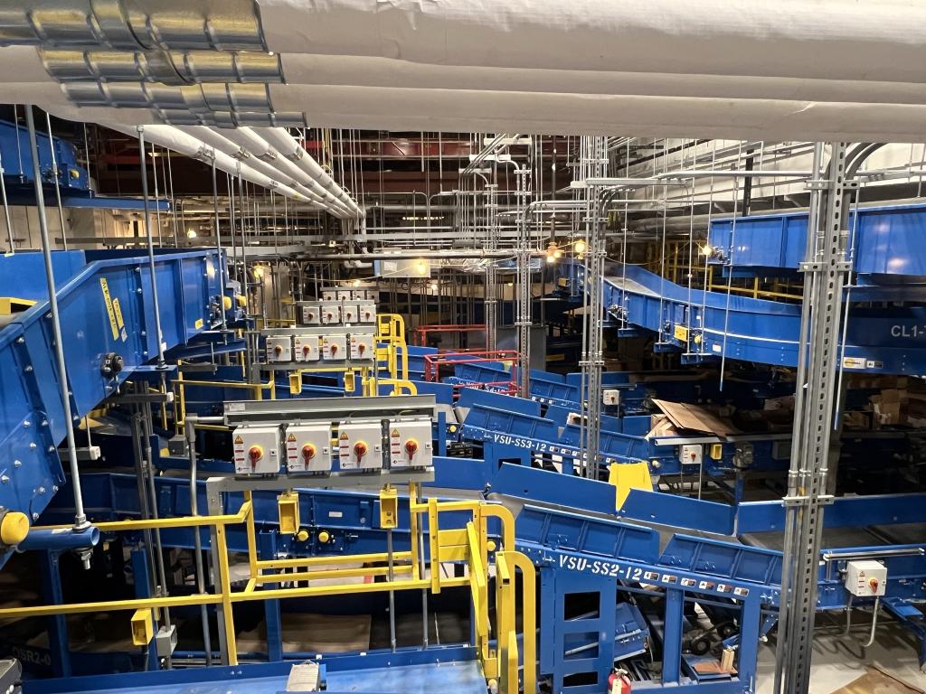 Overhead view of new baggage handling system conveyor belts under construction.