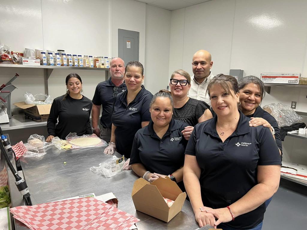 Delaware North team members pose for a group photo in the kitchen.