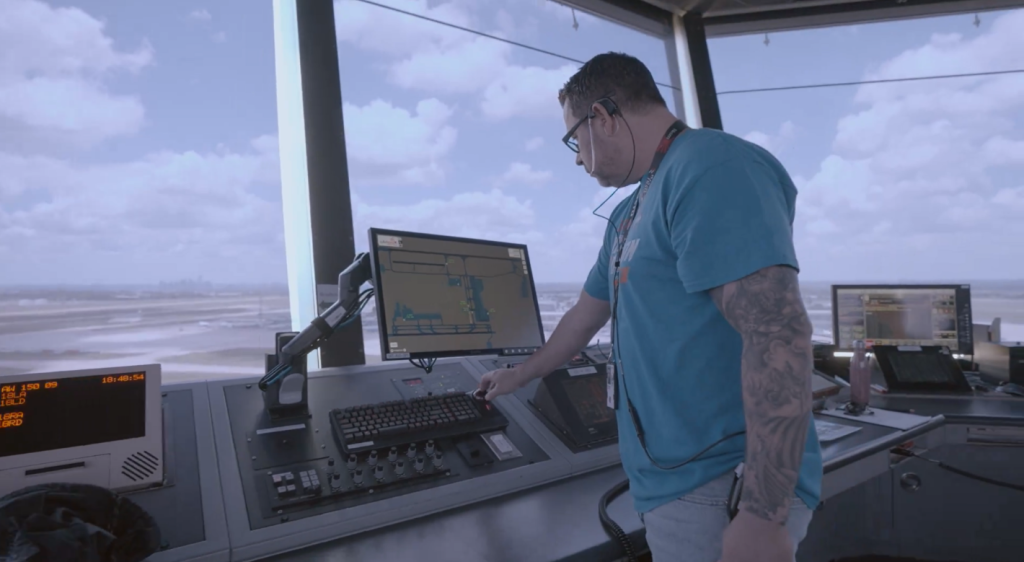AUS FAA employee looking at monitor showing new SAI system