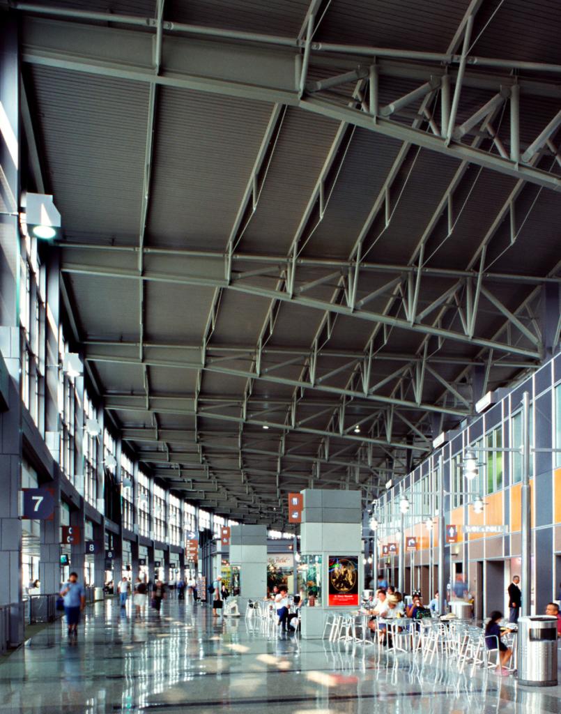 View of the new Austin Airport terminal floor to ceiling showing the tresses that look like tree branches. 