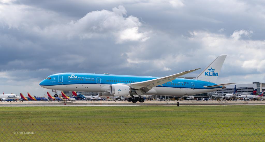 Photo from the Family Viewing Area of a KLM aircraft at AUS. The Barbara Jordan Terminal can be seen in the distant background.